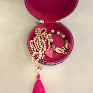 Lilly Pulitzer Jewelry Box with white beaded necklace and shell bracelet